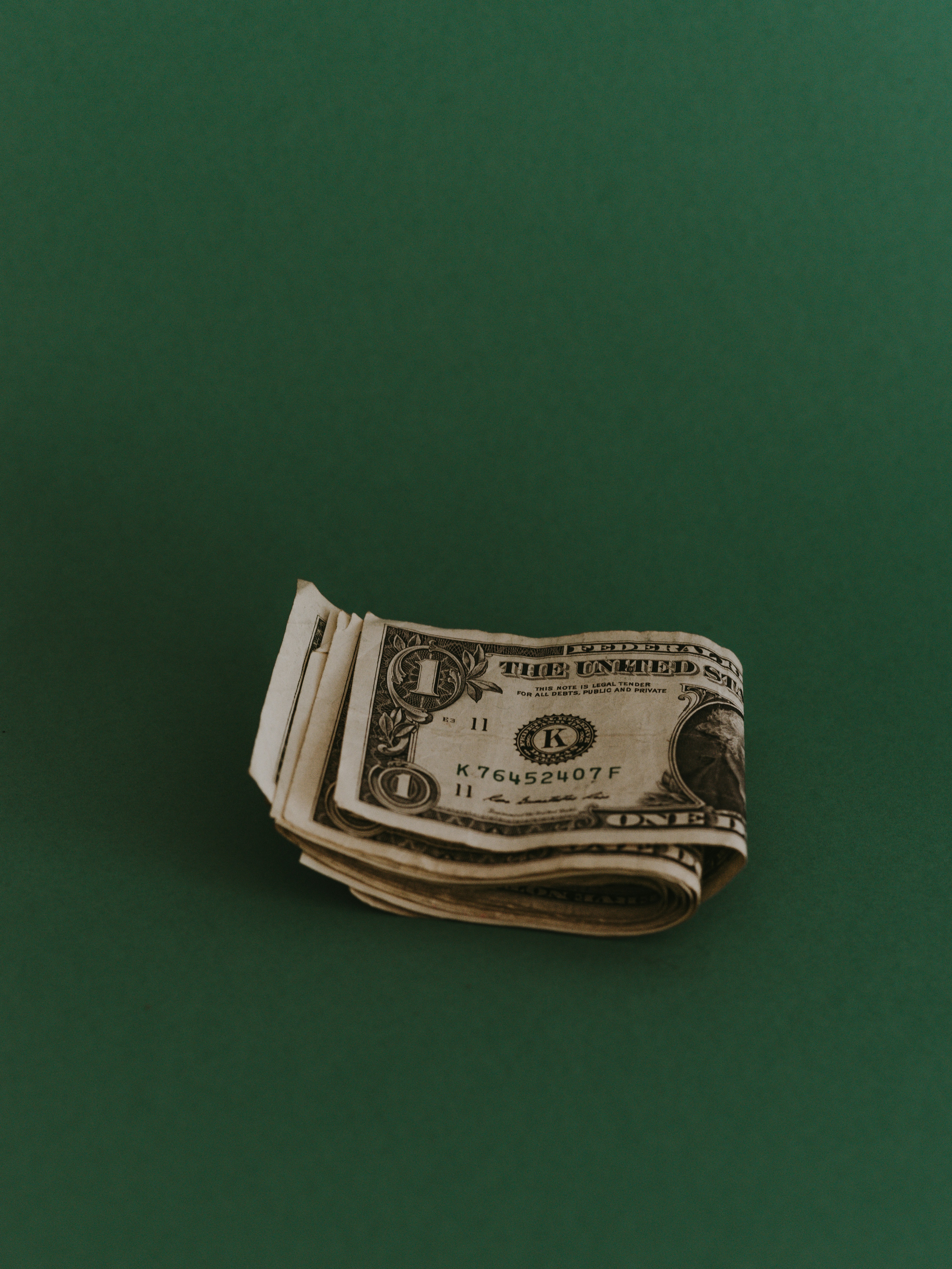 Small stack of dollar bills symbolizing affordable, tailored website pricing